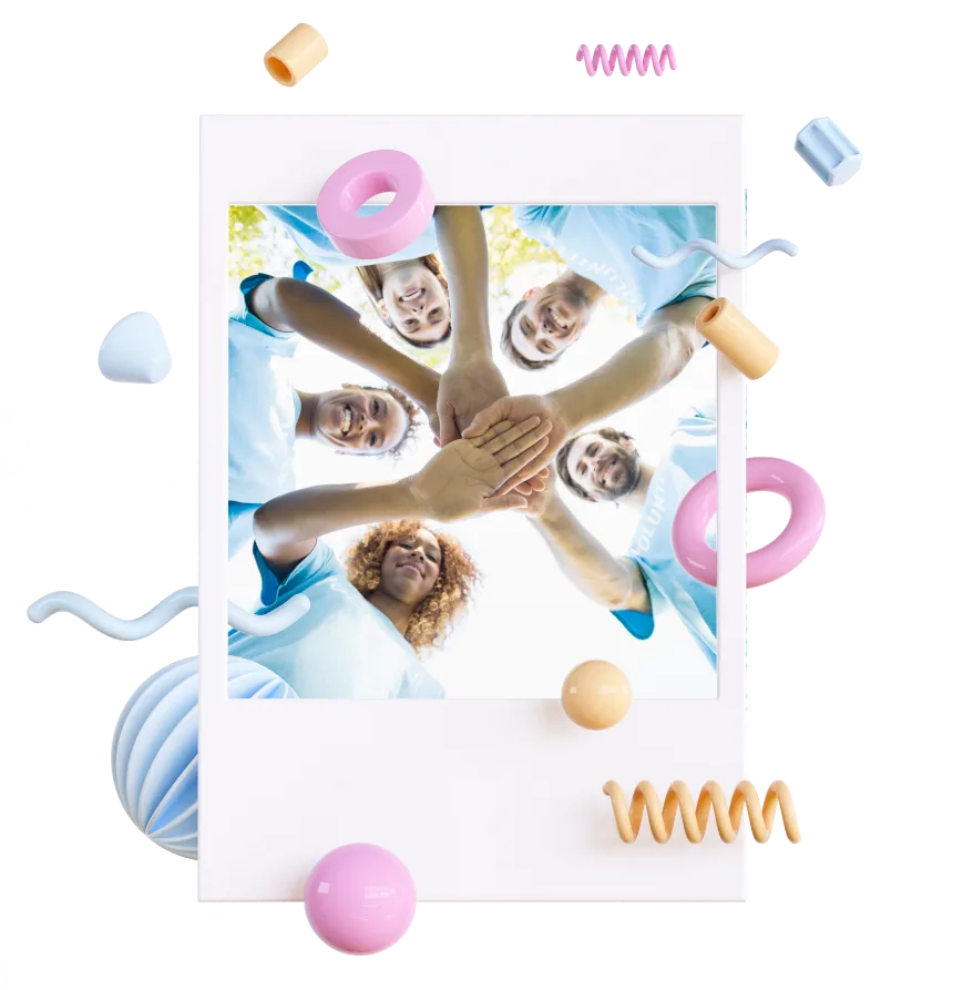 group of people putting hands together in a poloroid